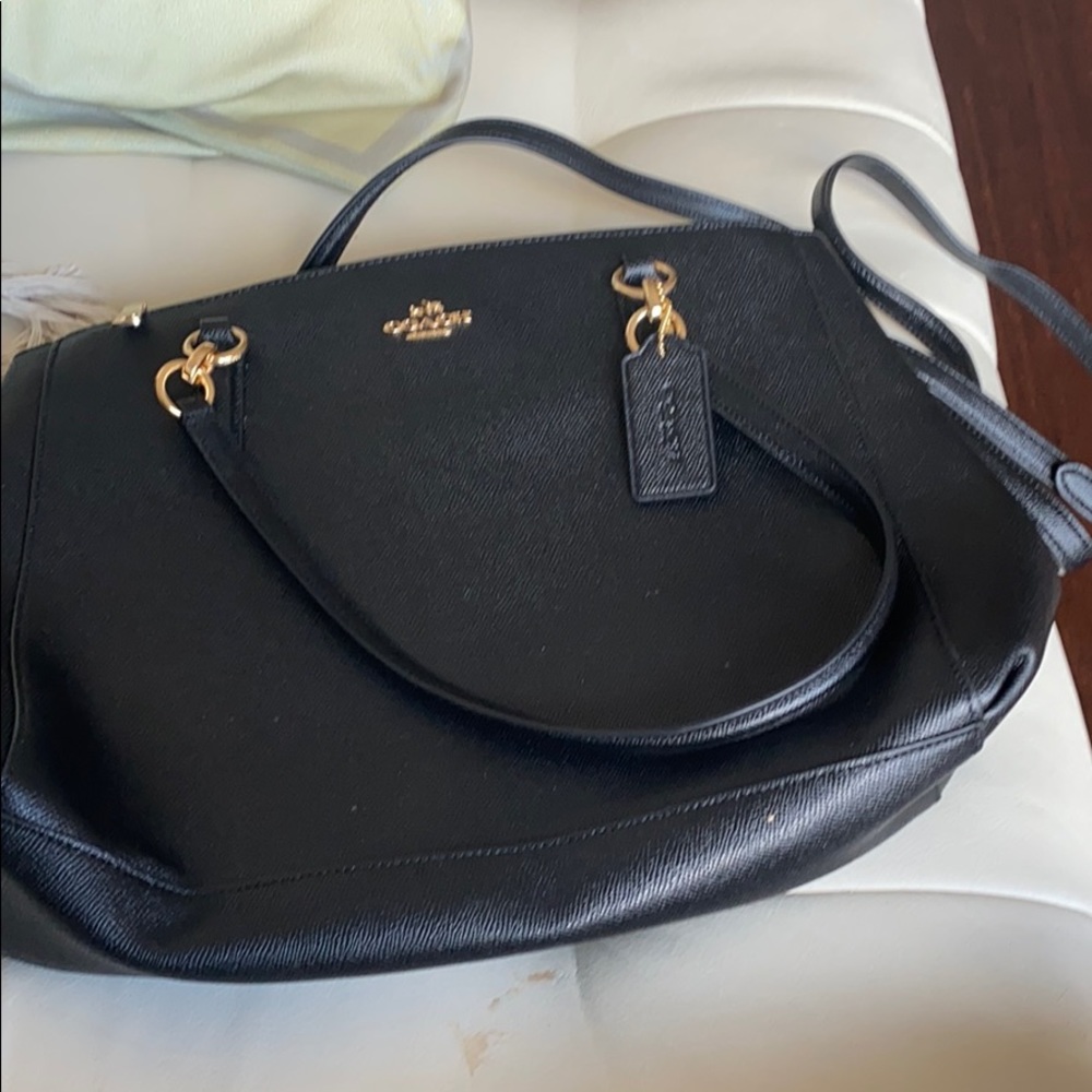 Brand new coach bag. Never used it .